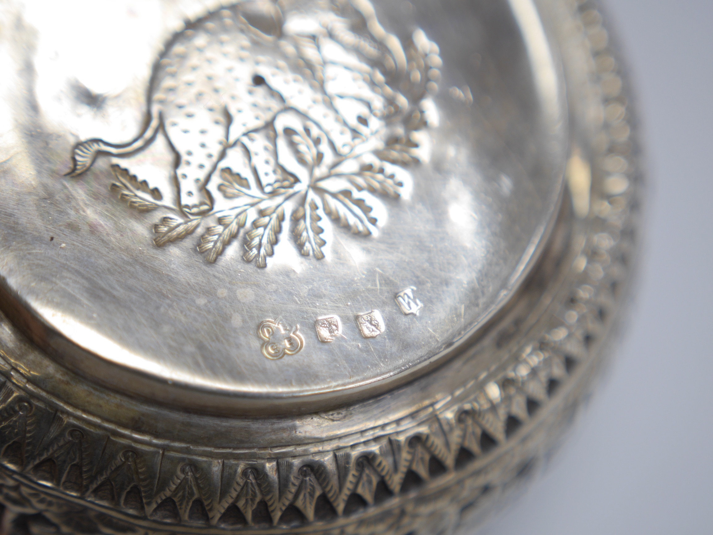 A late Victorian Scottish embossed silver bowl, in the Burmese style, David & George Edwards, Glasgow, 1893, diameter 11.2cm, 4.8oz. Condition - poor to fair